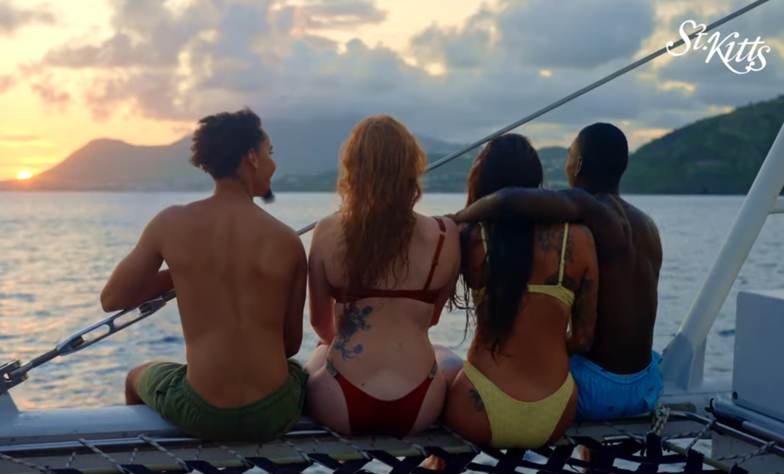 Friends on boat at sunset
